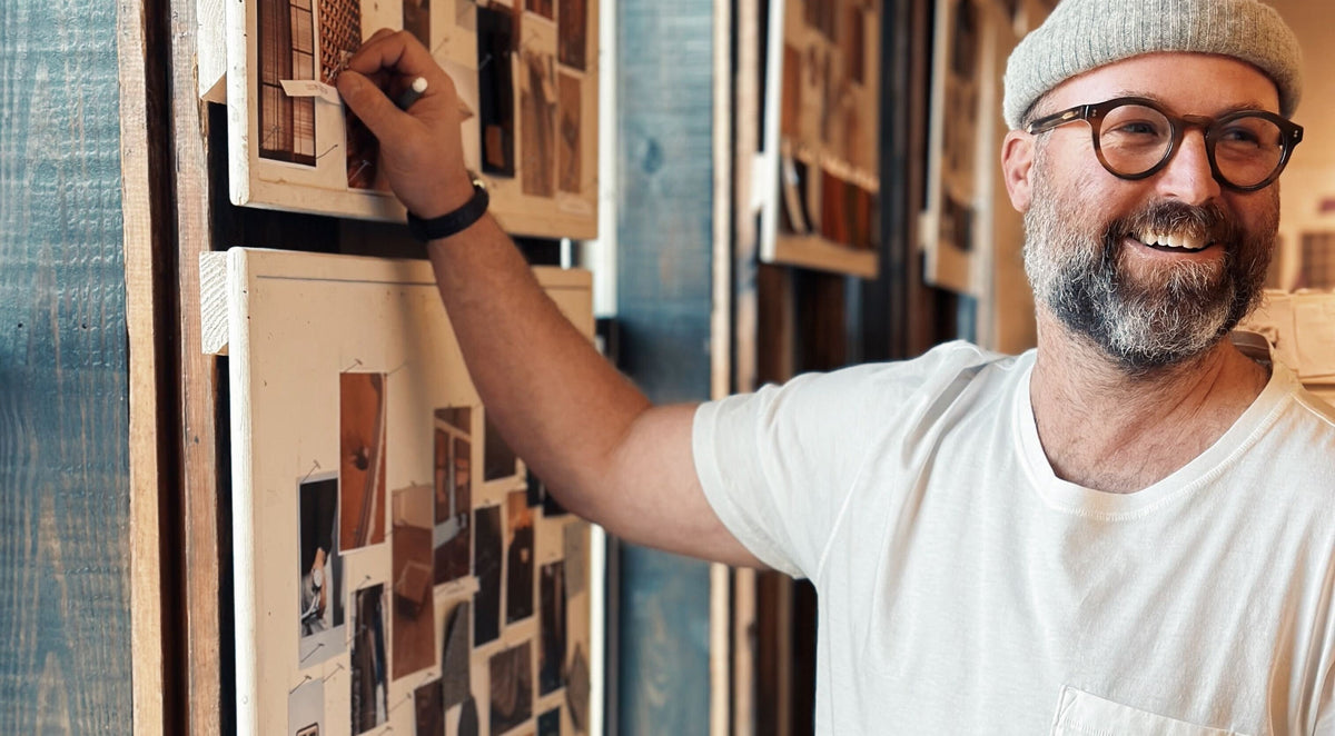 David Sunderland adjusts a moodboard at Billy Reid headquarters.