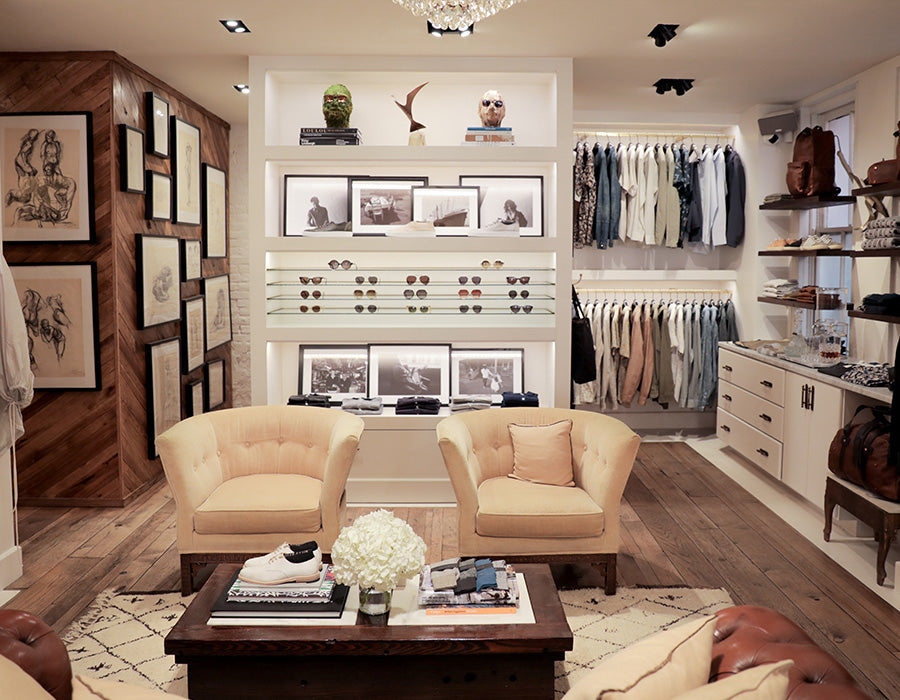 Modern interior design showroom with furniture and decor elements.