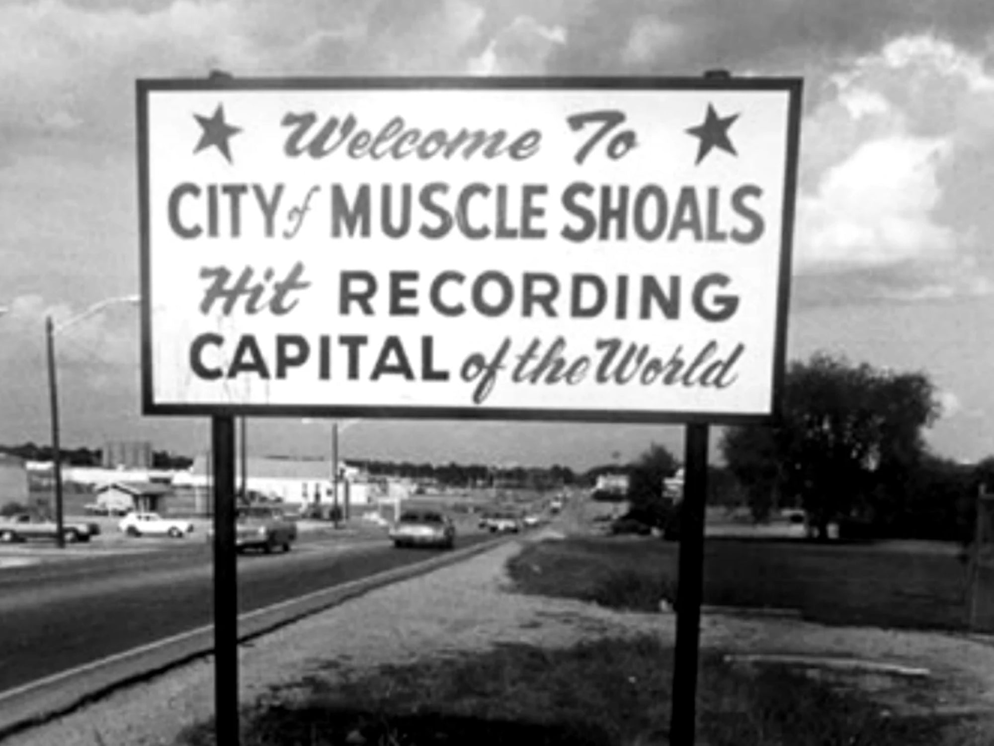 A sign reads: Welcome to City of Muscle Shoals, Hit Recording Capital of the World
