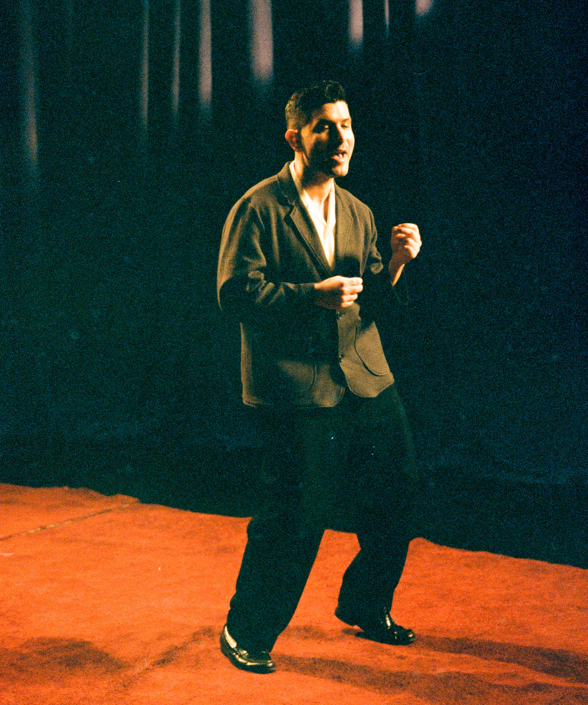 Member of the band singing.