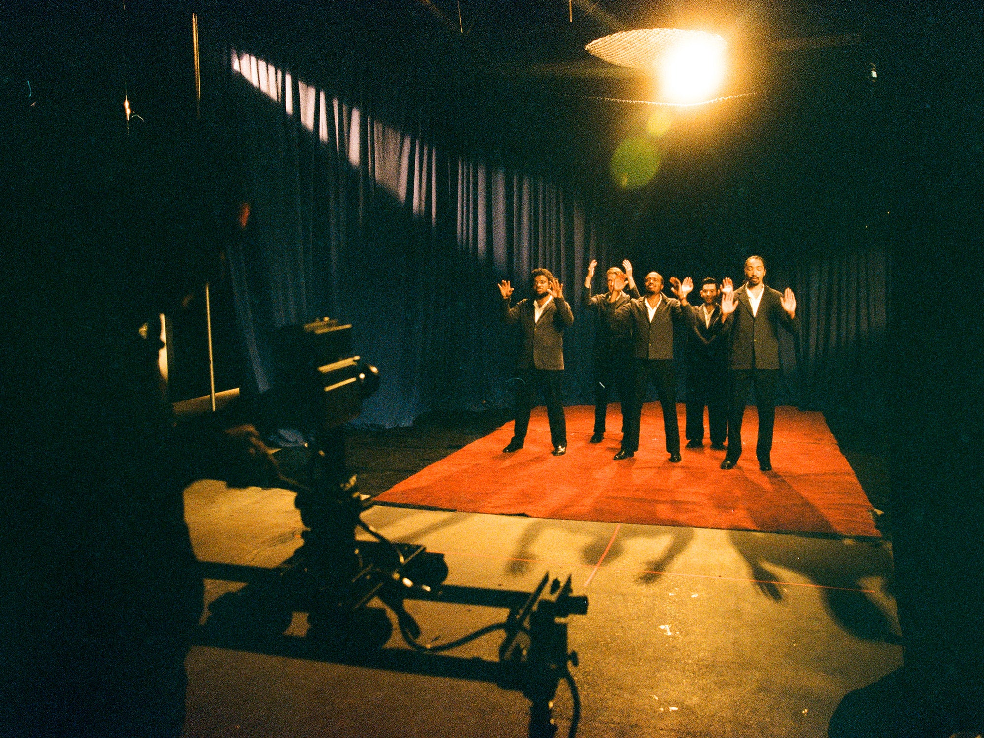 Durand Jones and the band stand in front of the camera.