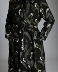 Black patterned coat on a gray background