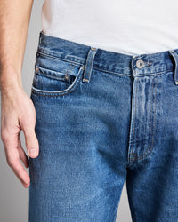 Close-up of blue jeans with a neutral background