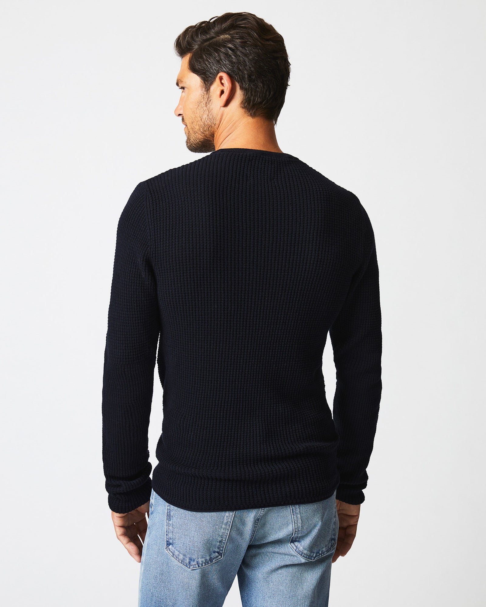 Male model wears the Mini Waffle Crew in Midnight