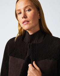 Female model wears the Short Shearling Jacket in Coffee Bean