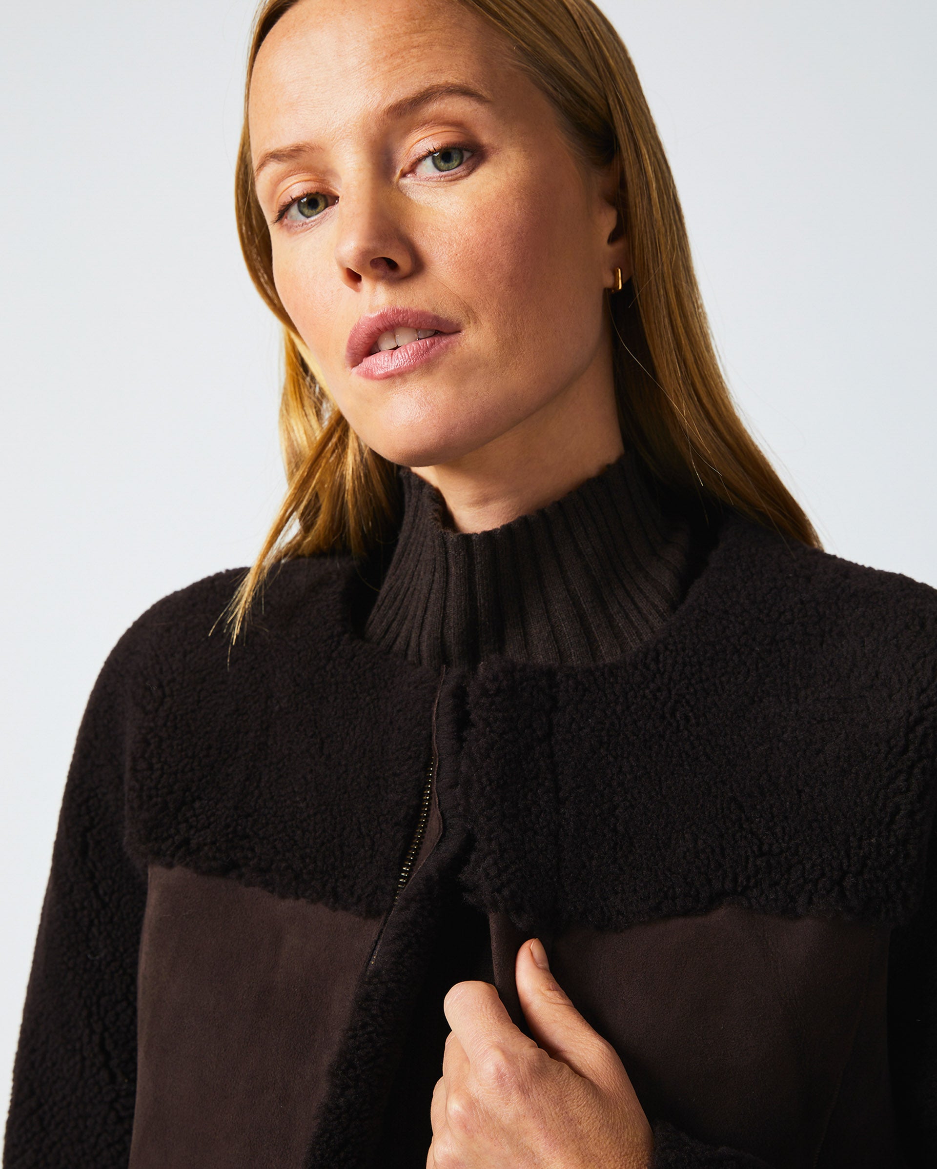 Female model wears the Short Shearling Jacket in Coffee Bean