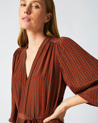 Female model wears the Tea Dress in Wine/Chocolate