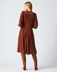 Female model wears the Tea Dress in Wine/Chocolate