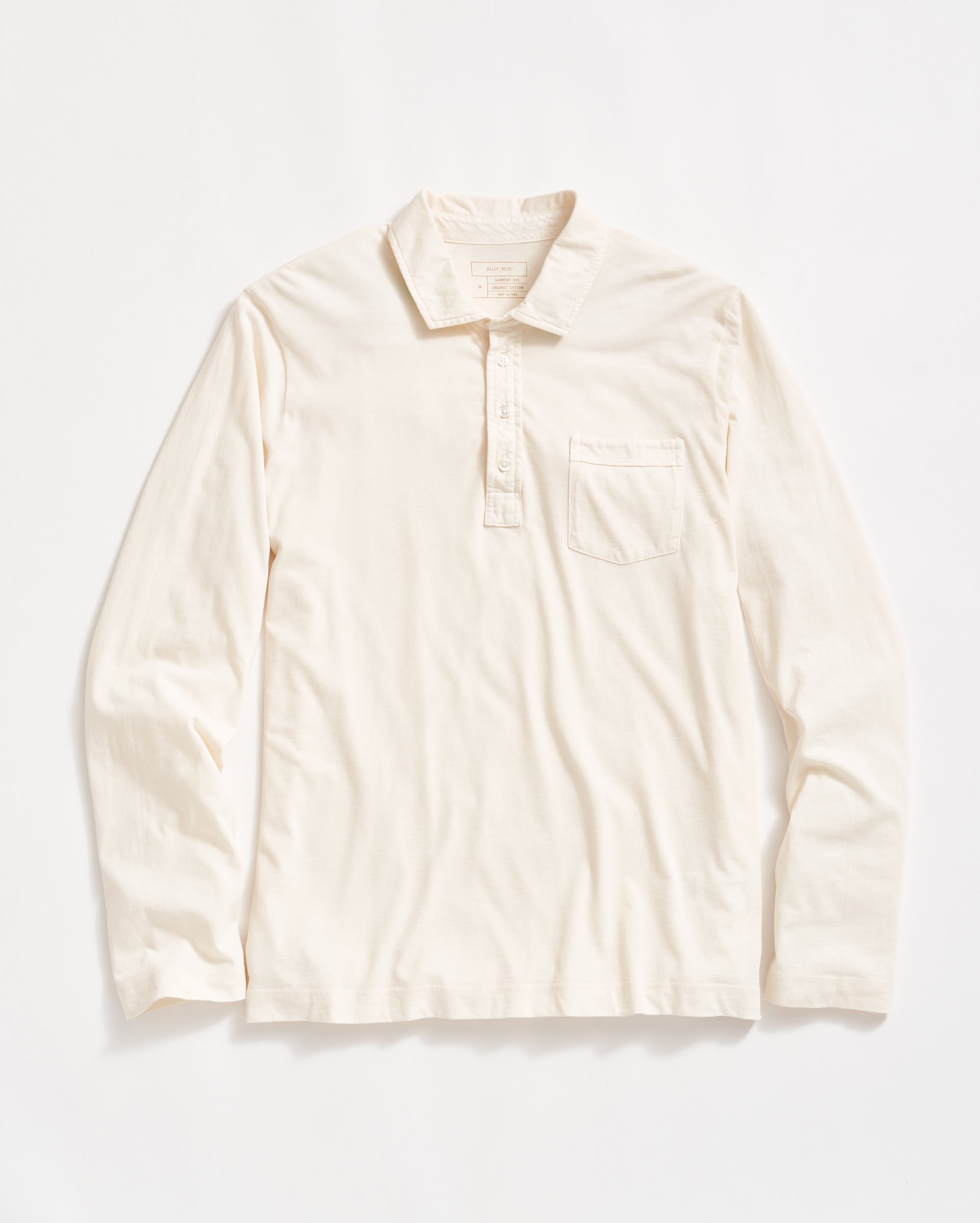 A long-sleeve, off-white collared shirt with a front pocket on the left chest and a partial button placket, laid flat on a white background.