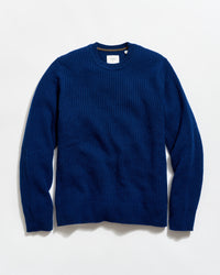 Blue sweater on a light gray background