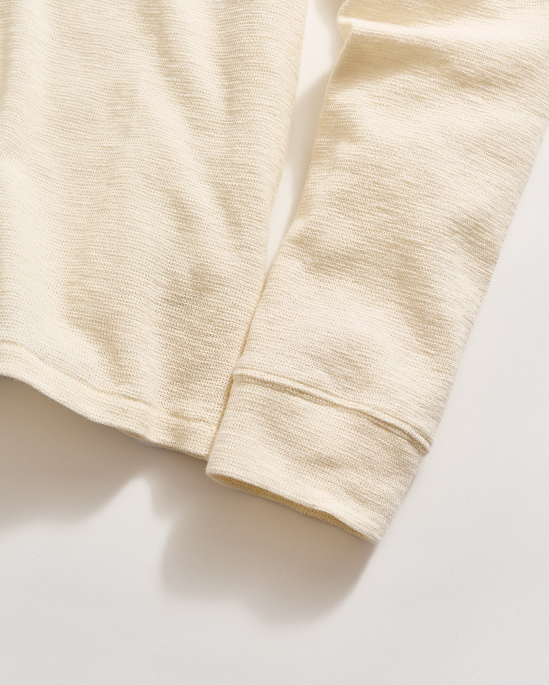 Close-up of beige fabric on a light background