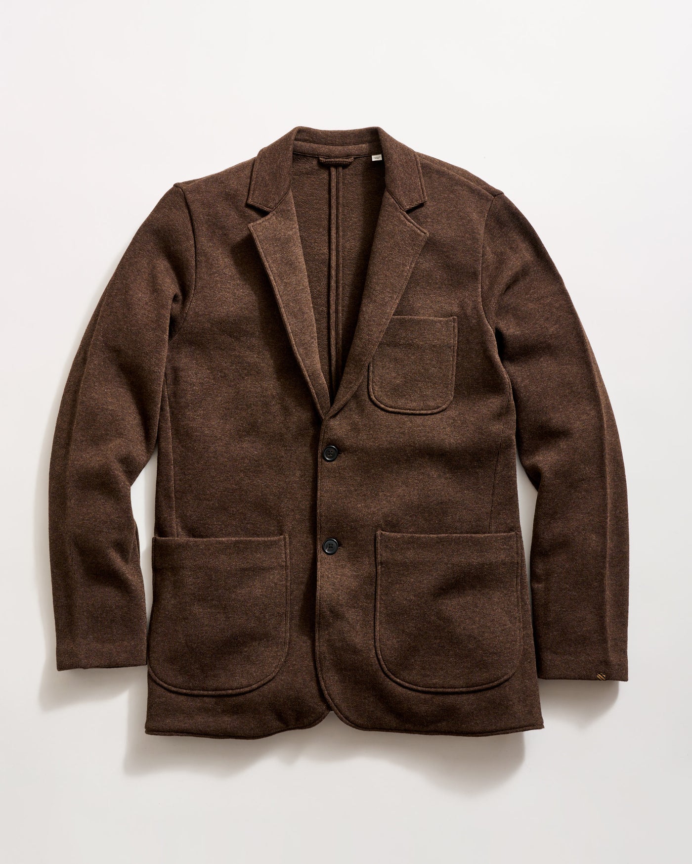 A brown wool blazer with two large front pockets, a chest pocket, and two black buttons, displayed flat on a white background.