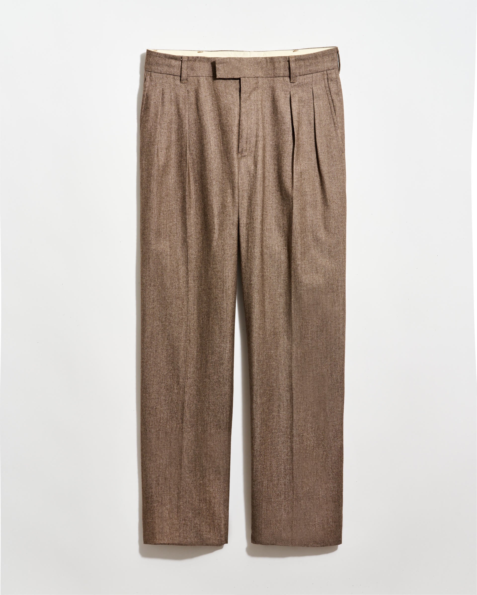 Light brown pleated dress pants with belt loops, front zipper, and straight legs, displayed against a plain white background.