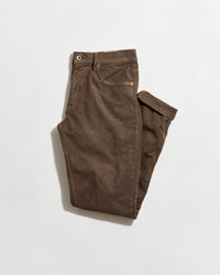 A pair of brown pants neatly folded on a plain white background. The pants have front and back pockets, belt loops, and a button closure at the waist.