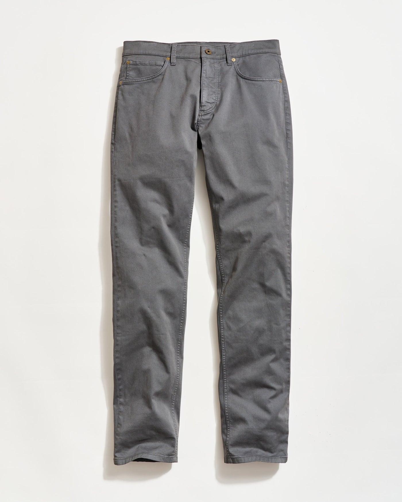 A pair of gray straight-leg pants with front and back pockets, belt loops, and a button and zipper closure, laid flat on a white background.