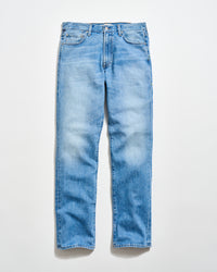 A pair of light blue, straight-leg jeans with a classic five-pocket design, laid flat on a white background.