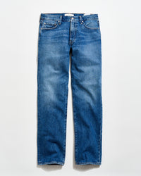 A pair of classic blue denim jeans with a straight-leg cut, five pockets, and a button fly, laid flat on a light background.