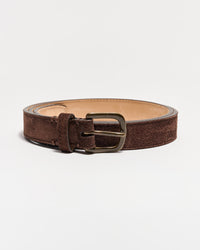 A brown suede leather belt with a metal buckle, coiled on a plain white background.
