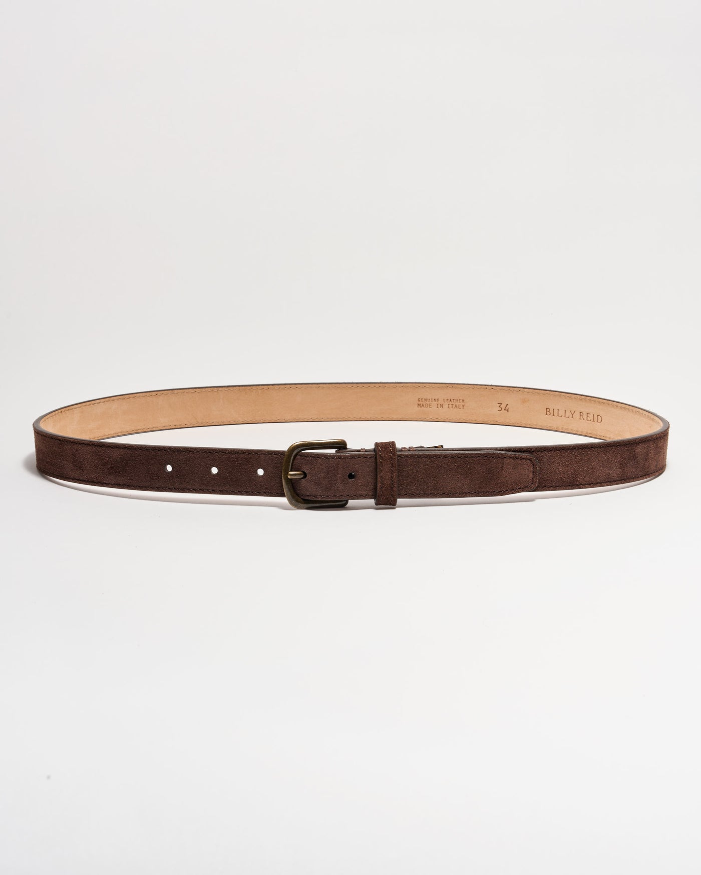 A brown suede leather belt with a brass buckle, laid flat in a circular shape on a white background. The interior of the belt is tan, and several adjustment holes are visible.