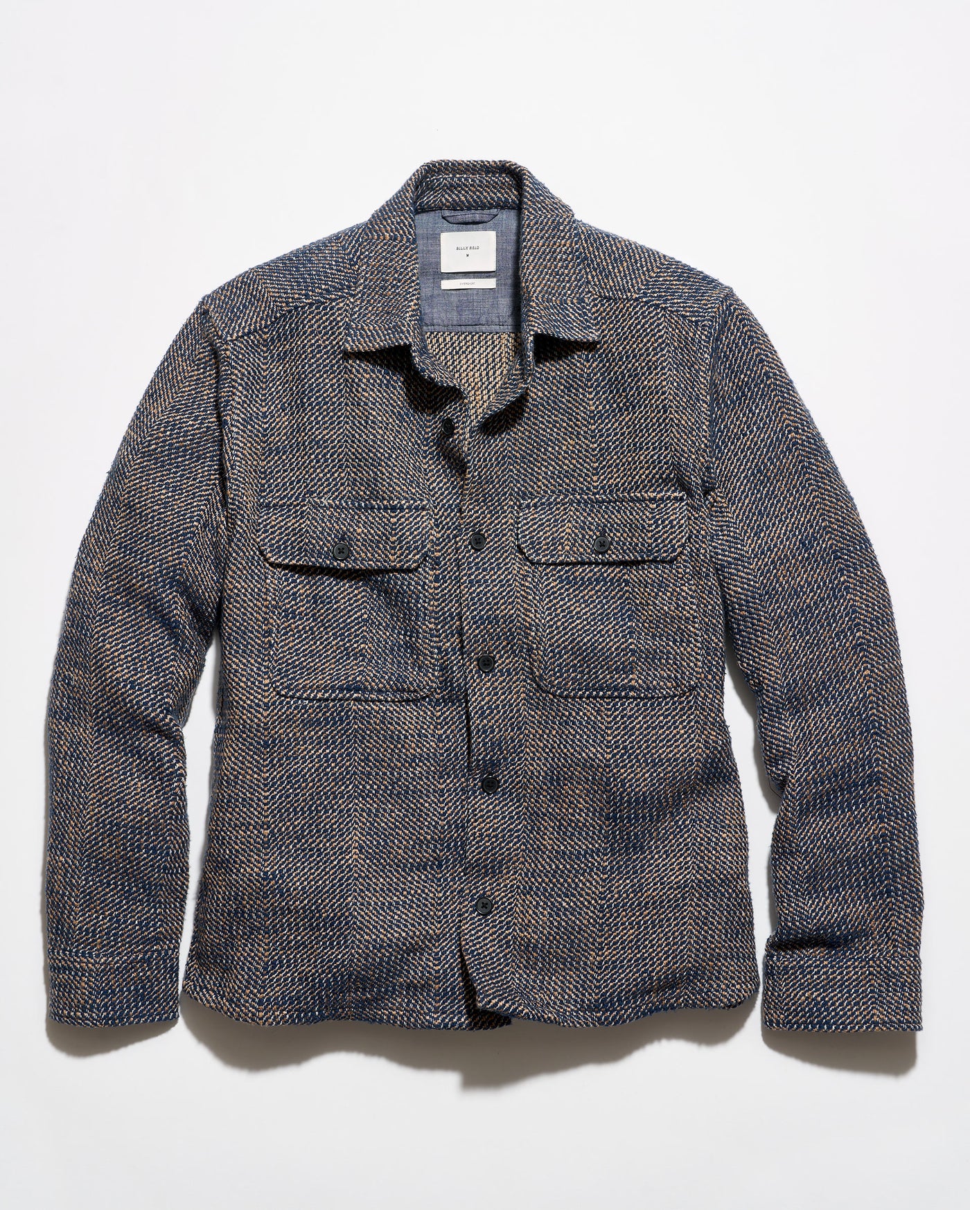 Blue and brown overshirt on a grey background.