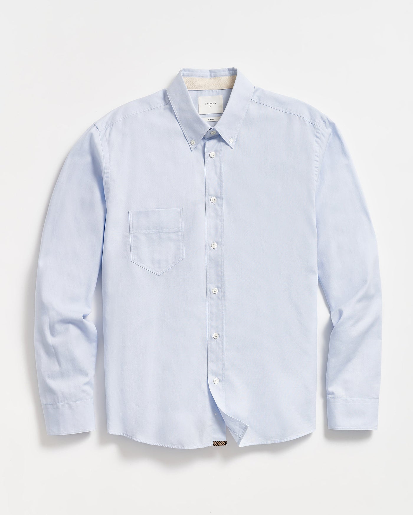 A light blue, long-sleeve button-down shirt with a single chest pocket, buttoned collar, and white buttons, laid flat on a white background.