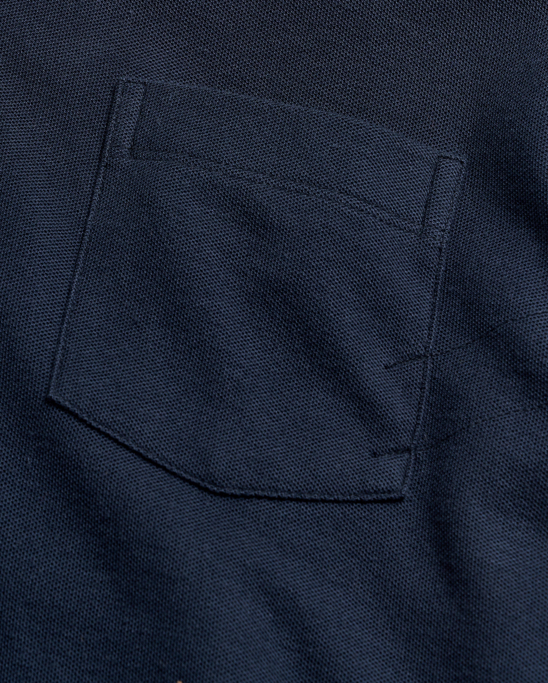 Close-up of a navy blue pocket on a garment