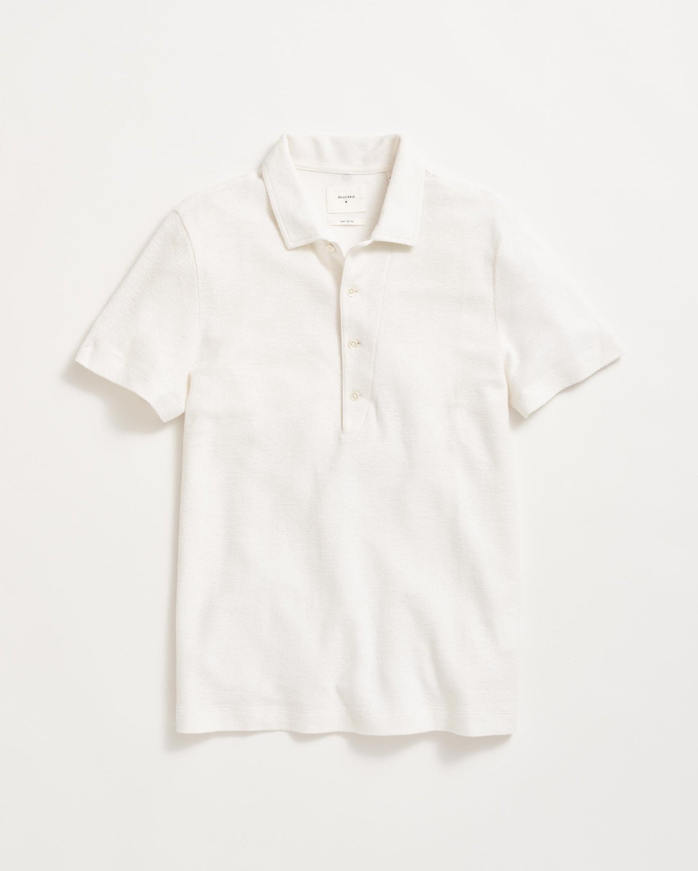 A plain white short-sleeve polo shirt with a collar and three buttons, laid flat on a white background.