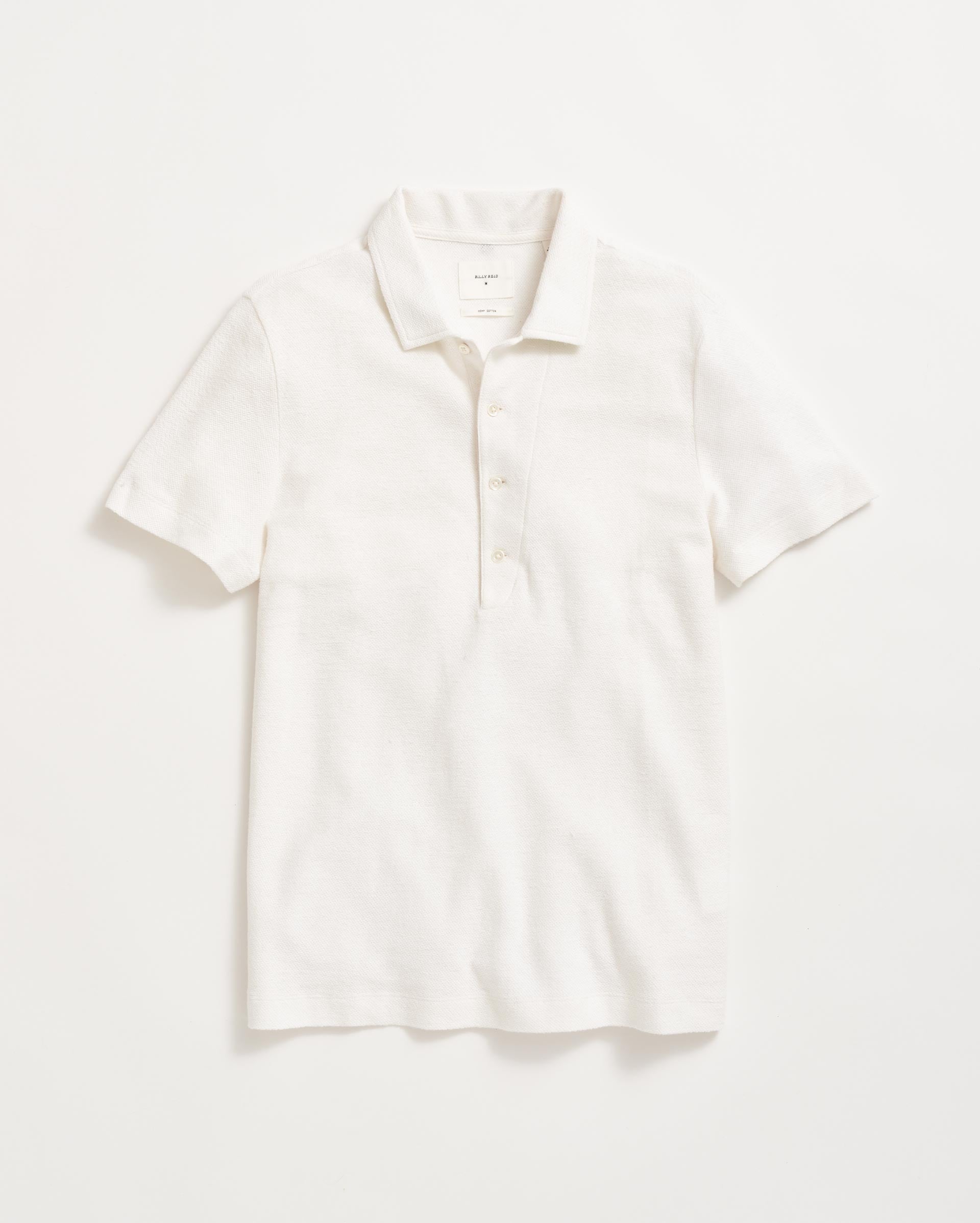 A plain white short-sleeve polo shirt with a collar and three buttons, laid flat on a white background.