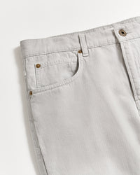 Light gray denim jeans shown from the waist down to mid-thigh, featuring front pockets, belt loops, and a metal button closure, photographed on a white background.