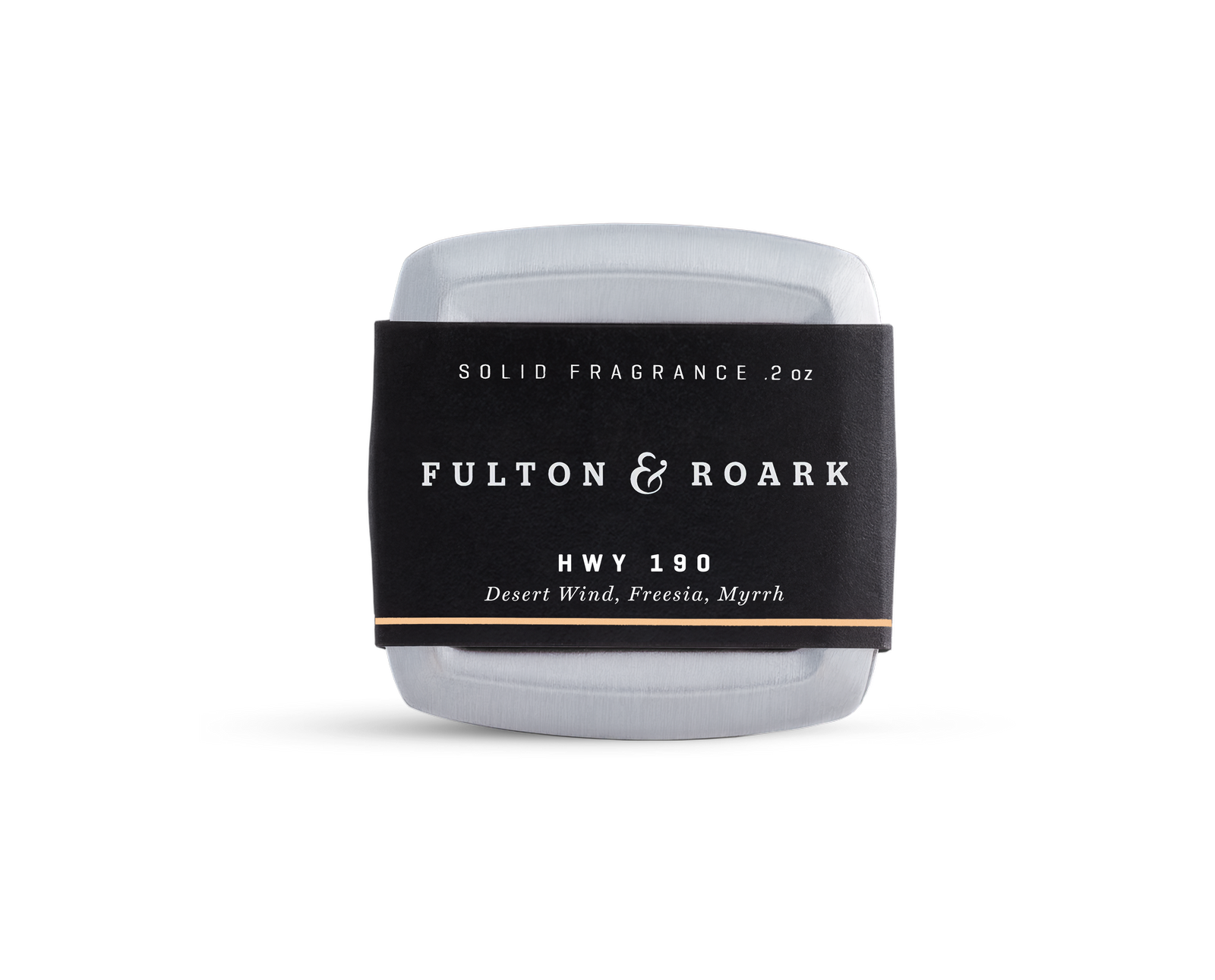 A rectangular metal tin of Fulton & Roark solid fragrance, HWY 190, with a black label featuring the scents Desert Wind, Freesia, and Myrrh. The tin is placed against a plain white background.