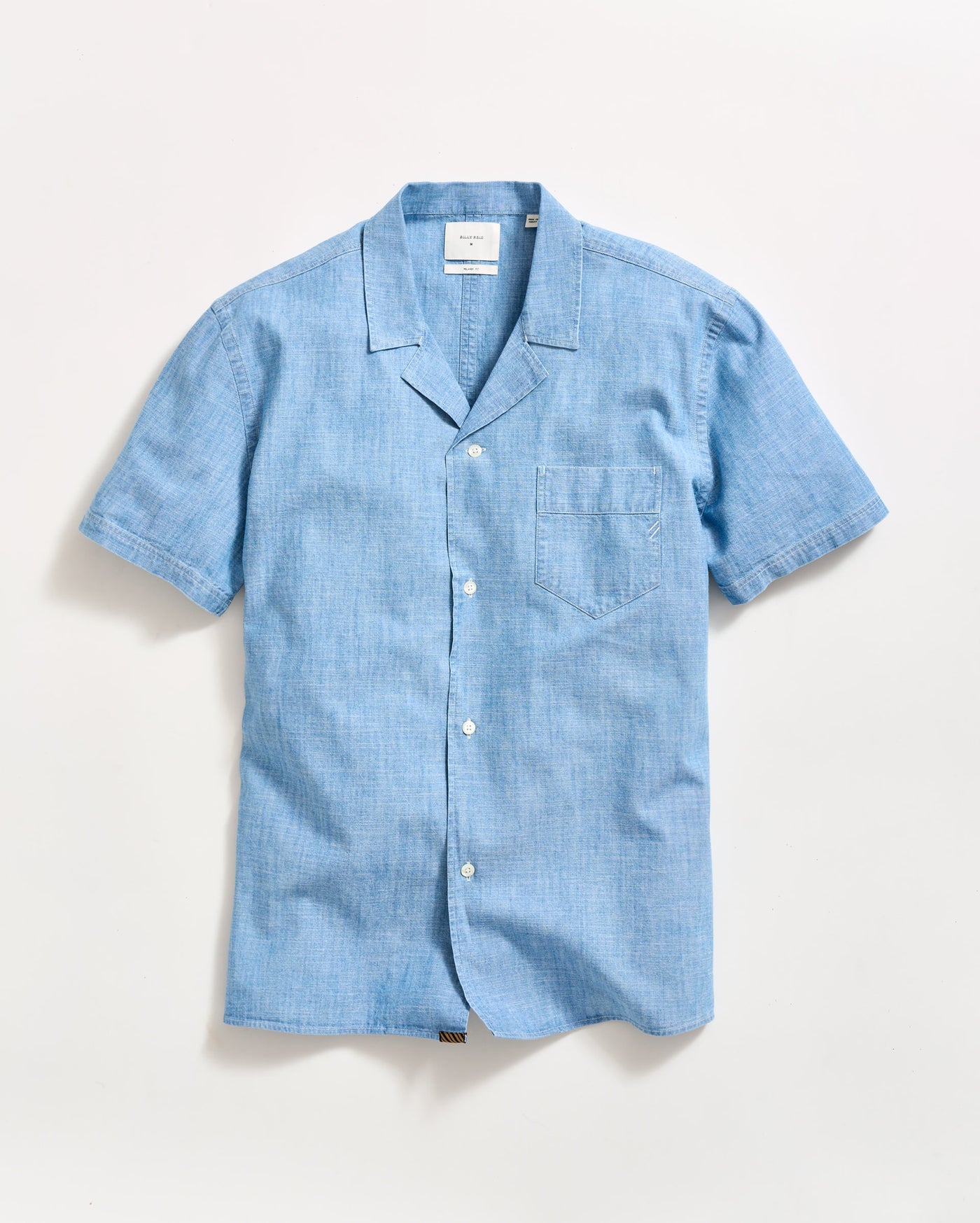 A light blue short-sleeve button-up shirt with a notched collar and a chest pocket, laid flat on a white background.