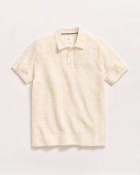 A short-sleeved, off-white knit polo shirt with a collar and a two-button placket, displayed flat against a plain white background.