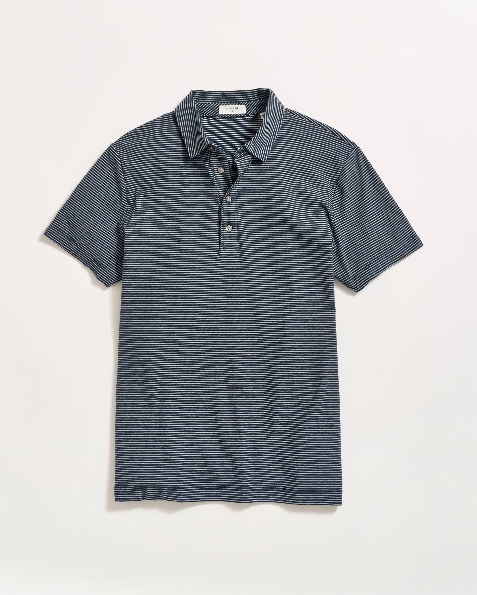 A short-sleeved, navy blue polo shirt with thin white horizontal stripes, a collar, and a three-button placket, laid flat on a plain white background.