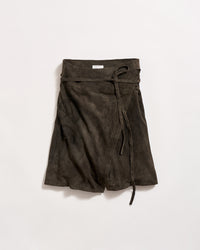 A dark brown suede wrap skirt with an embroidered pattern on one side and a long tie belt, displayed against a plain white background.