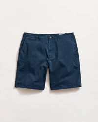 A pair of navy blue chino shorts with side pockets, a small coin pocket on the right, and a button closure, laid flat on a white background.