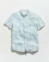 Light blue denim shirt on a white background
