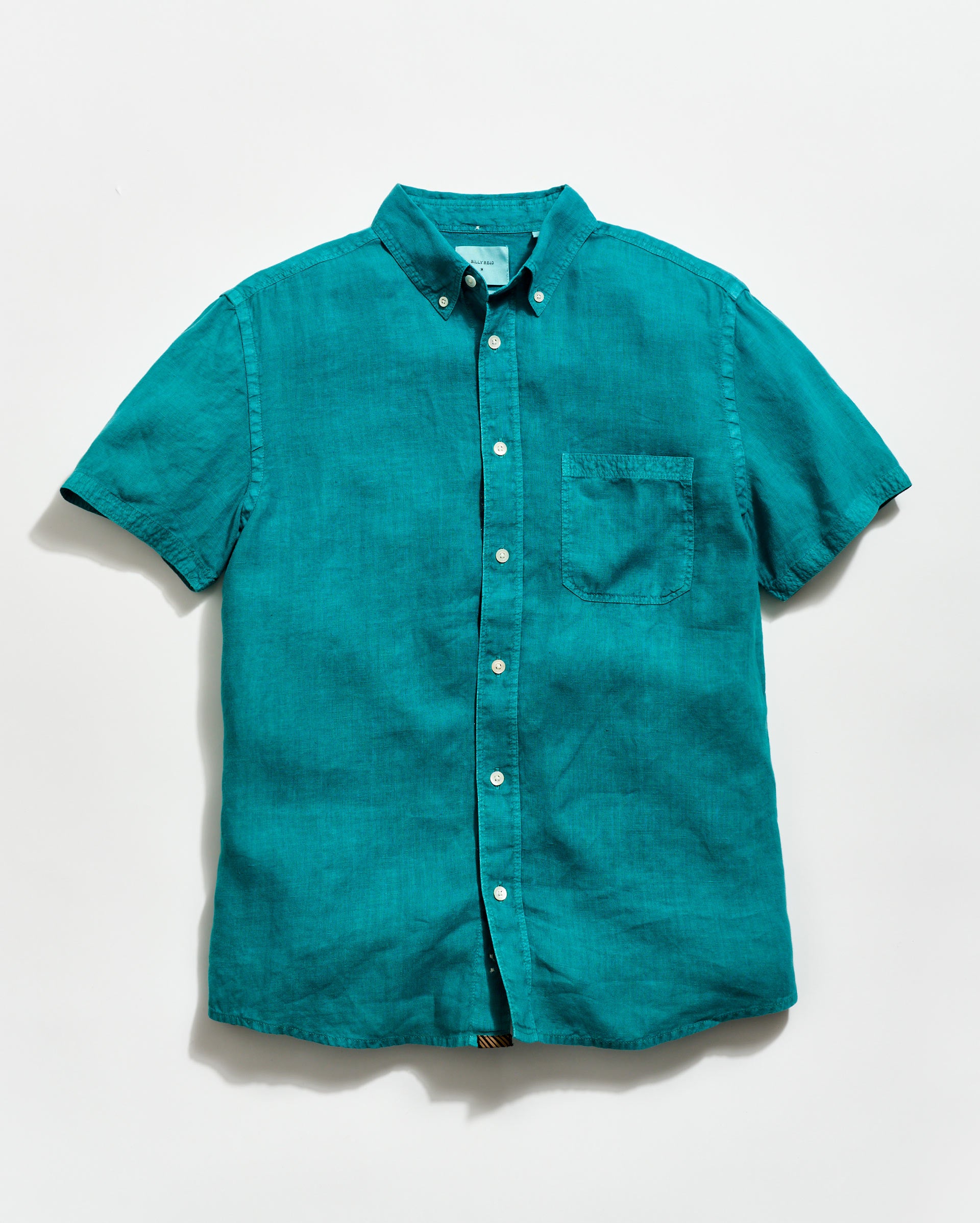 Teal short-sleeve shirt on a white background