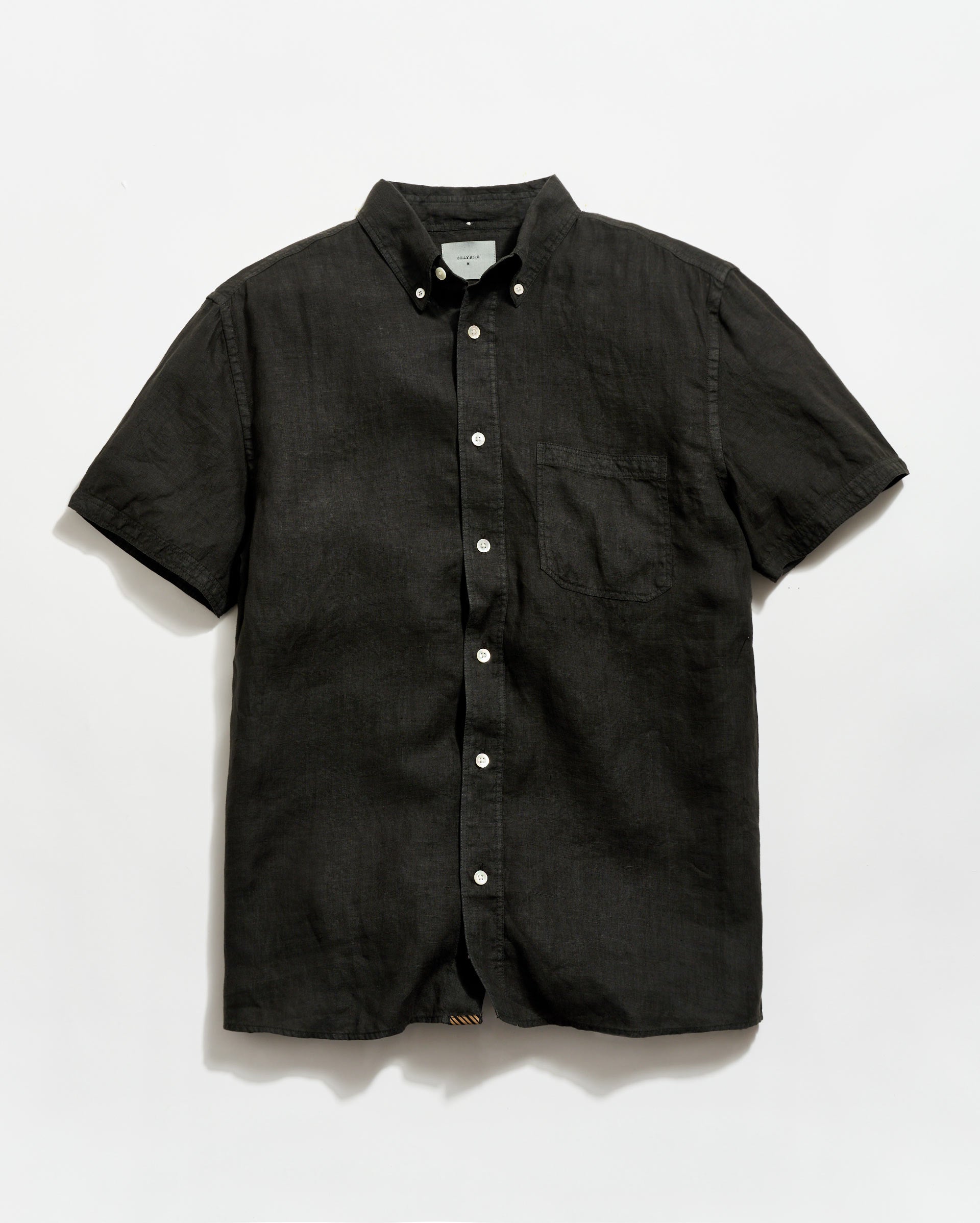 Black short-sleeve button-up shirt on a white background