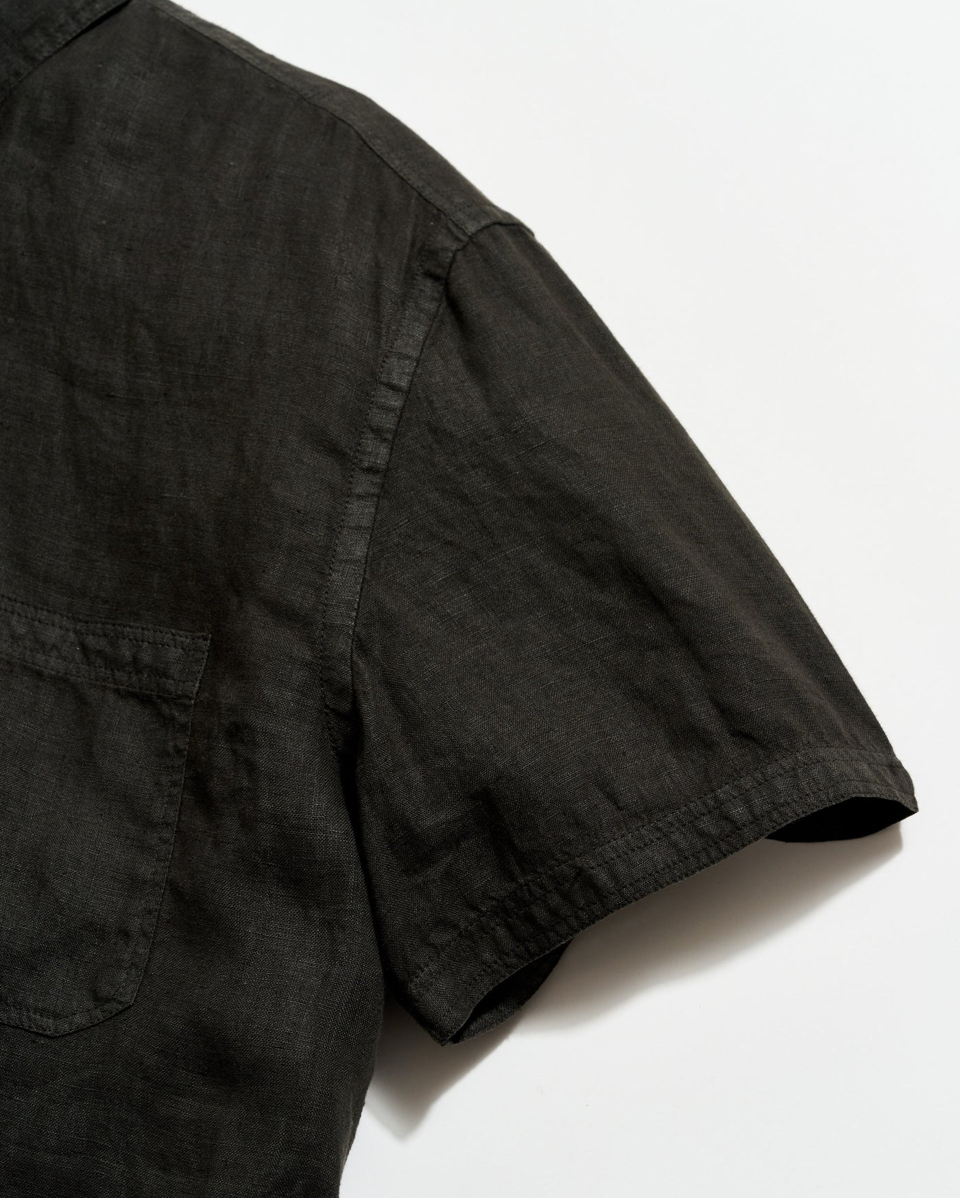 Black shirt with short sleeves on a white background