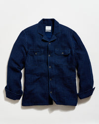 Blue checkered shirt on a light gray background