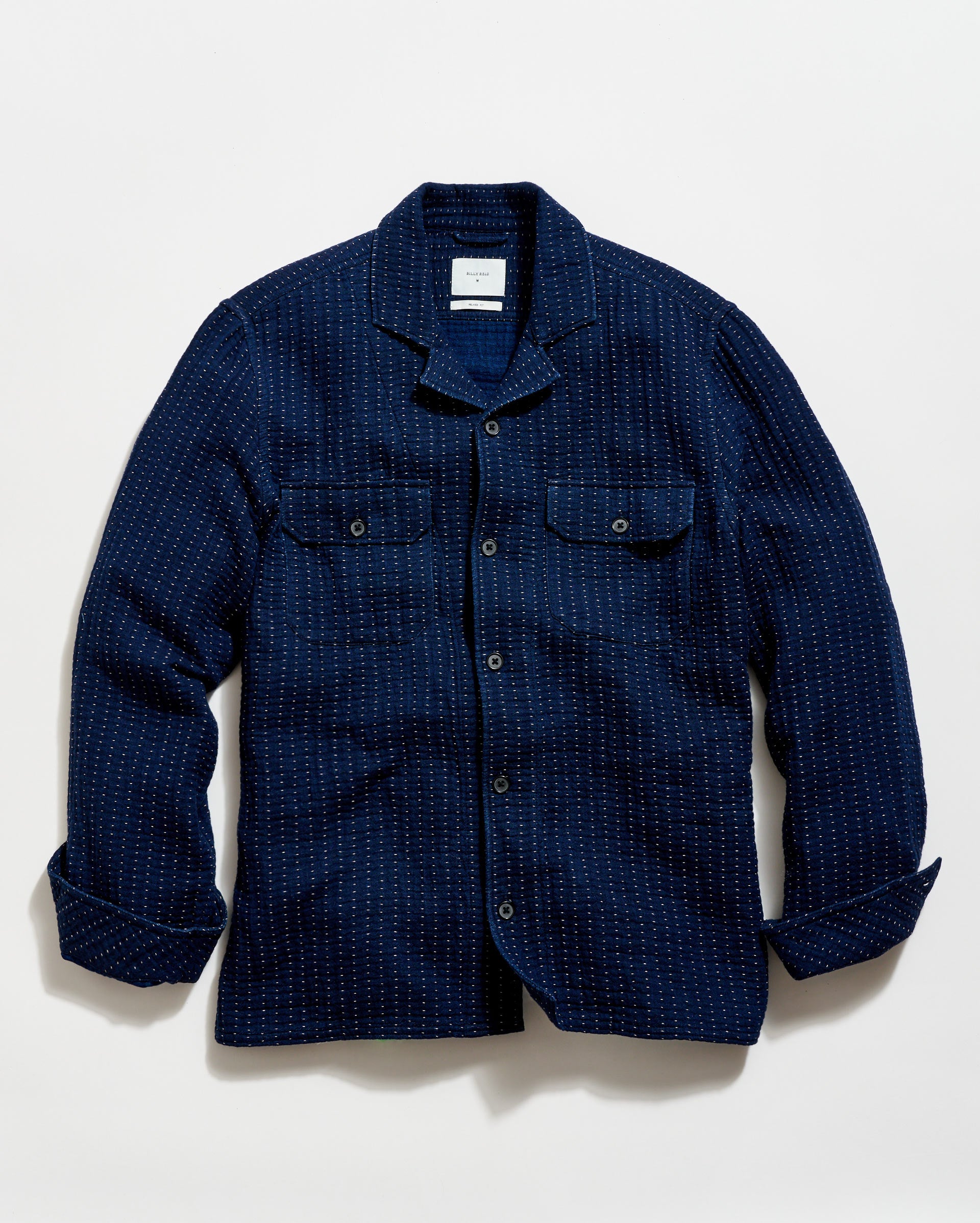 Blue checkered shirt on a light gray background