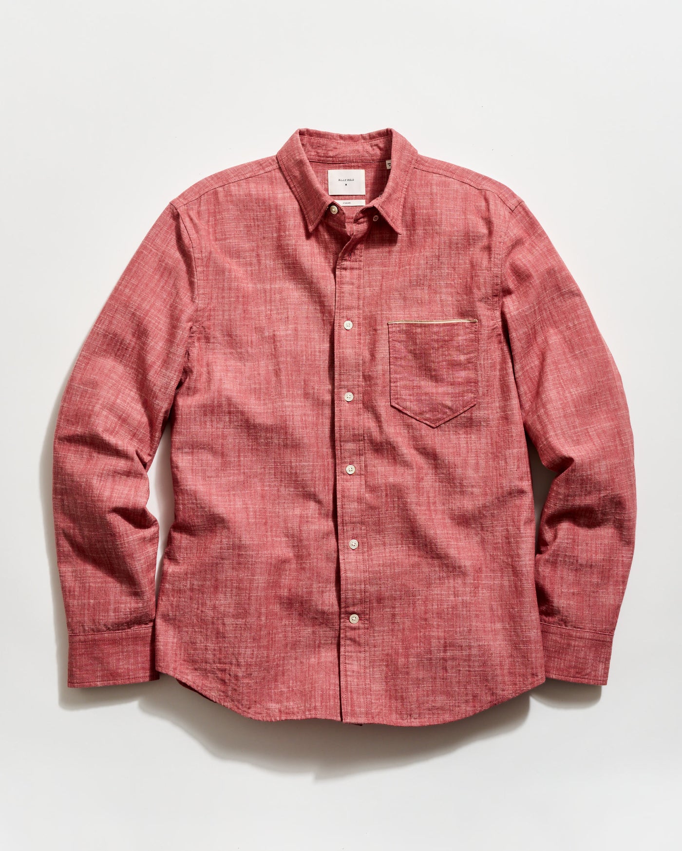 Red button-up shirt on a white background