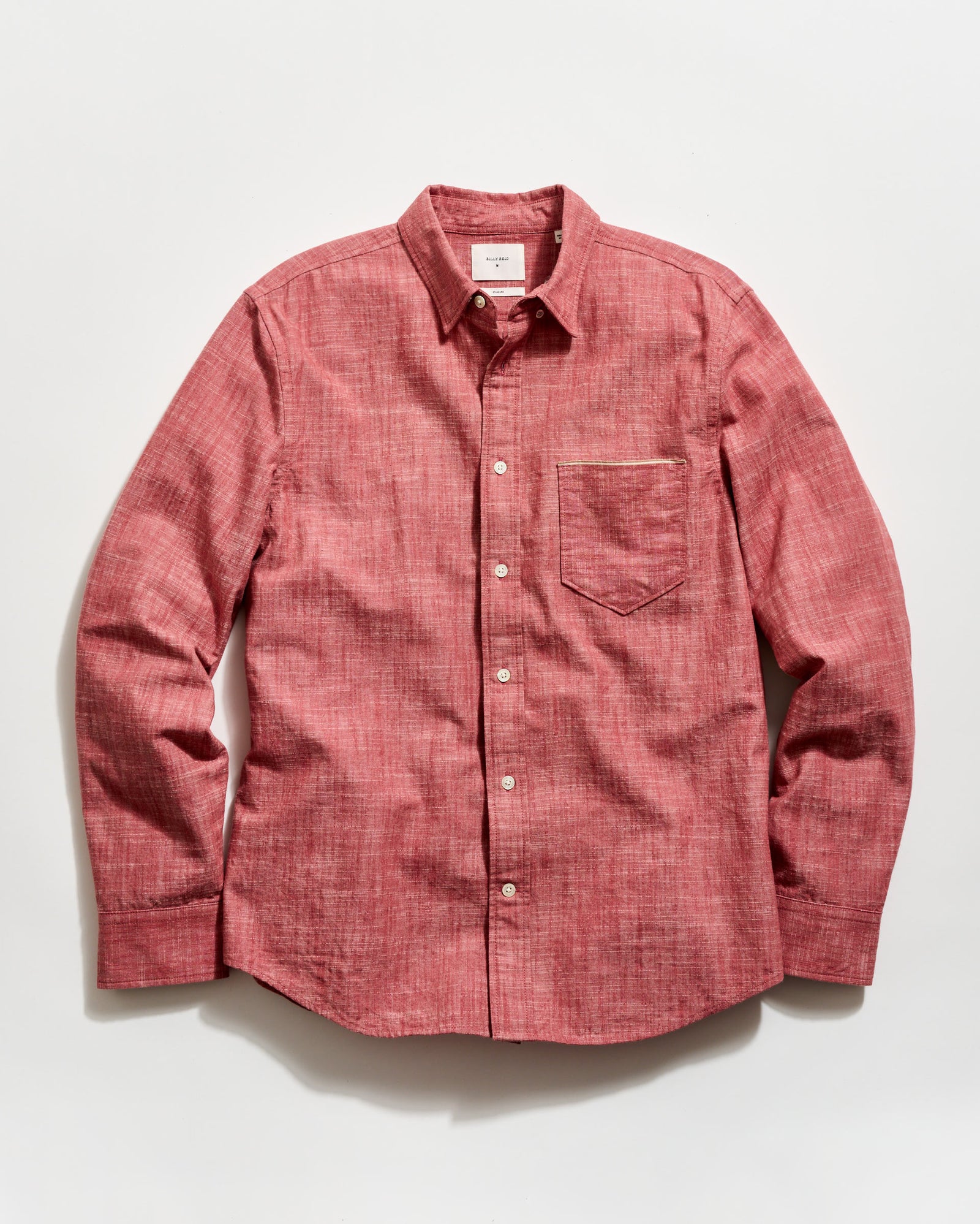 Red button-up shirt on a white background