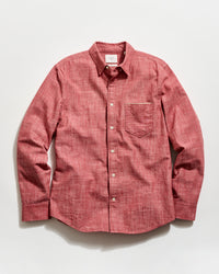 Red button-up shirt on a white background