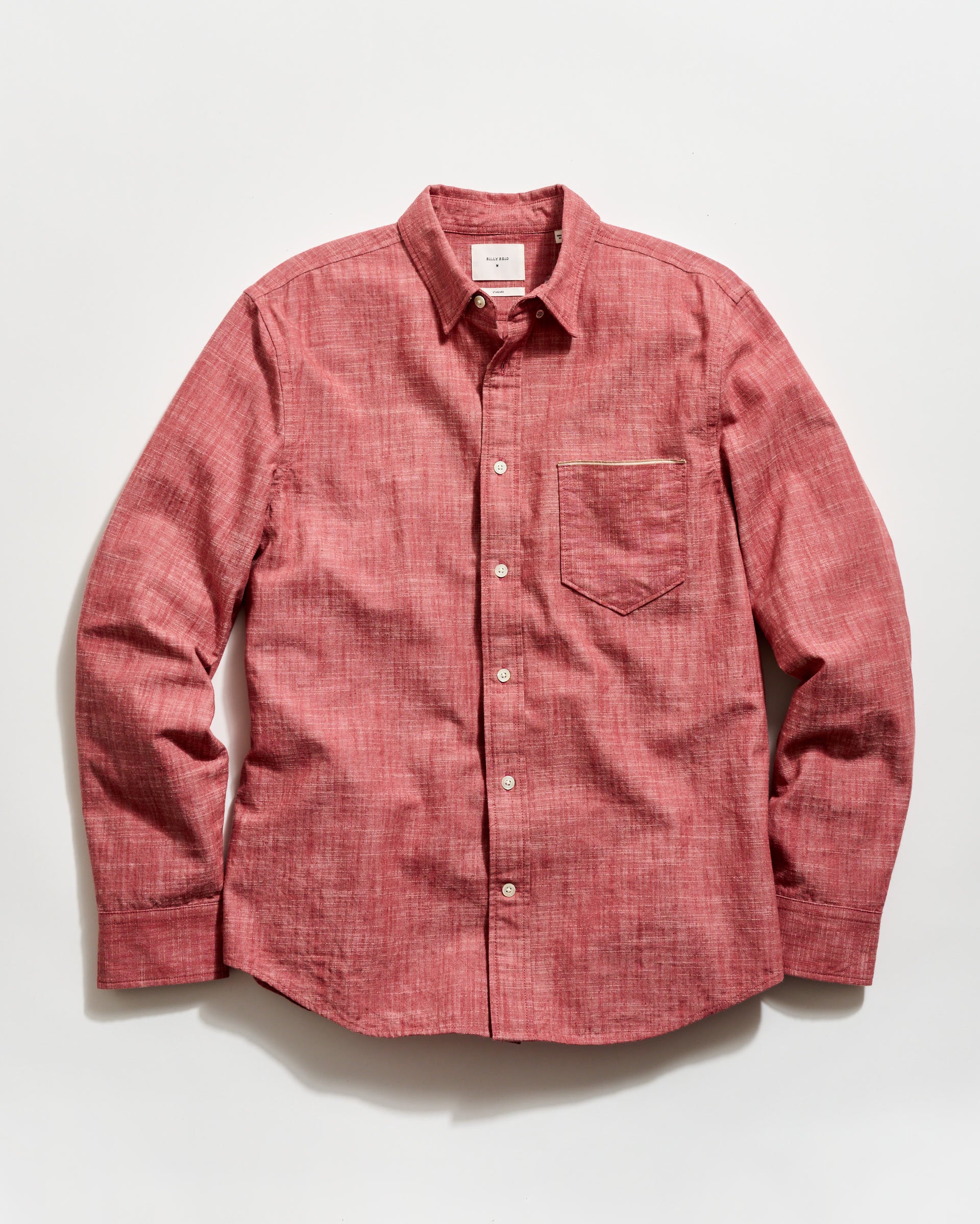 Red button-up shirt on a white background