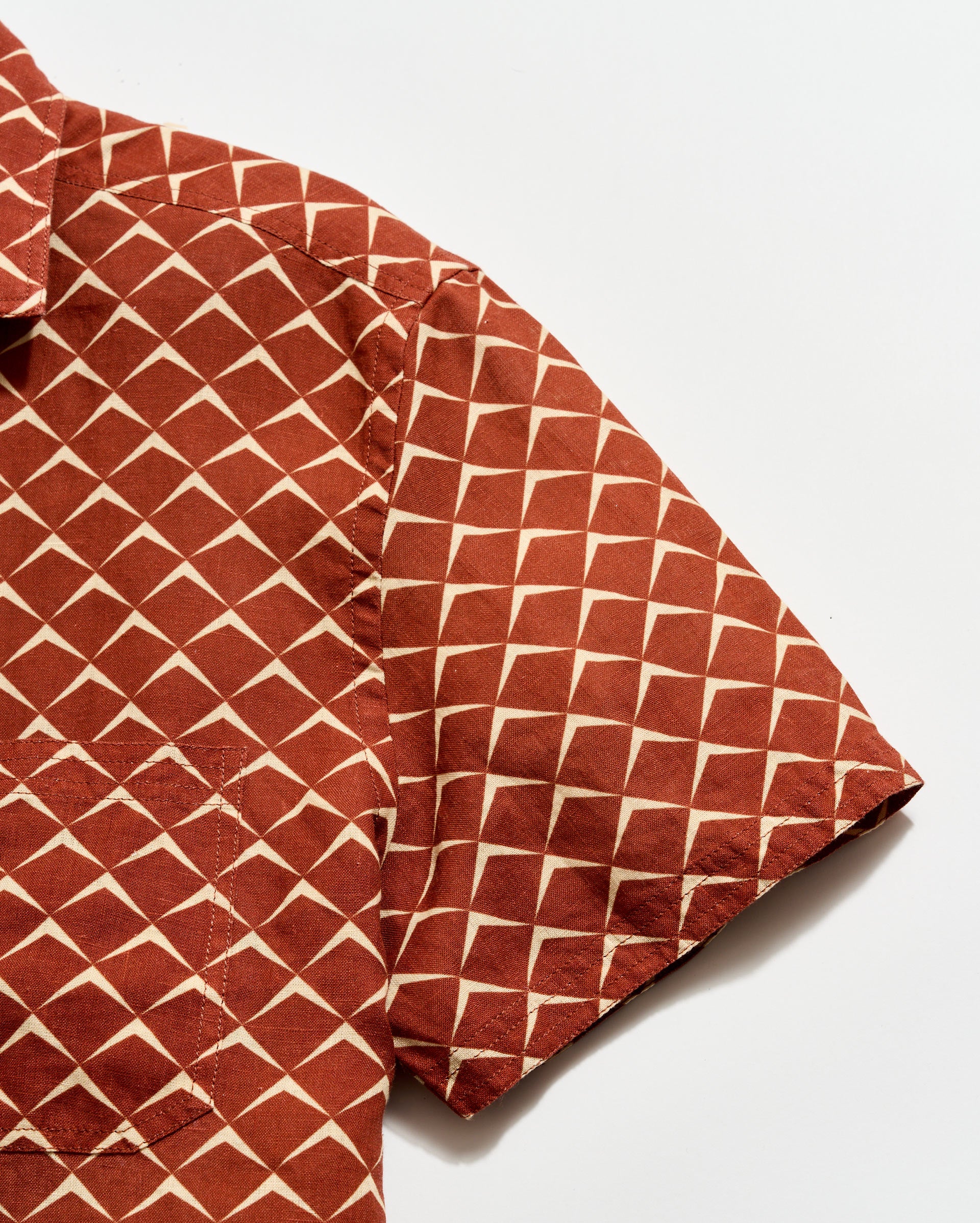 Brown geometric patterned fabric on a white background