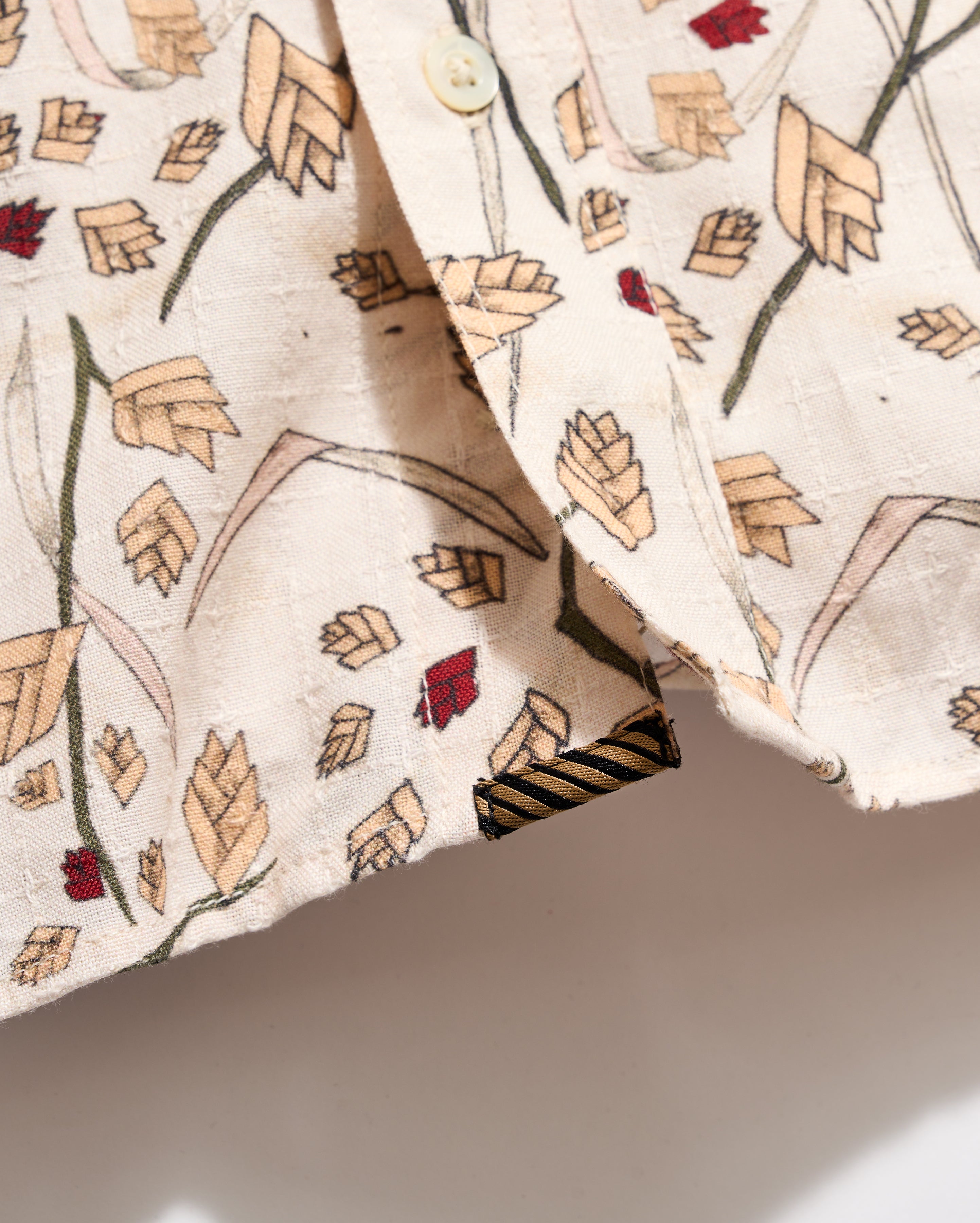 Close-up of a fabric with leaf pattern on a neutral background