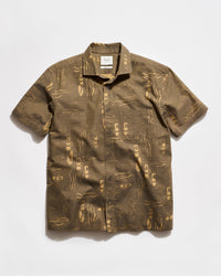 Brown patterned shirt on a white background