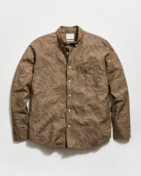Brown patterned shirt on a white background