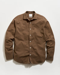 Brown button-up shirt on a white background